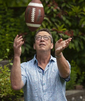 Ed Willes gets acquainted with a Canadian soccer ball at his home in North Vancouver this week.