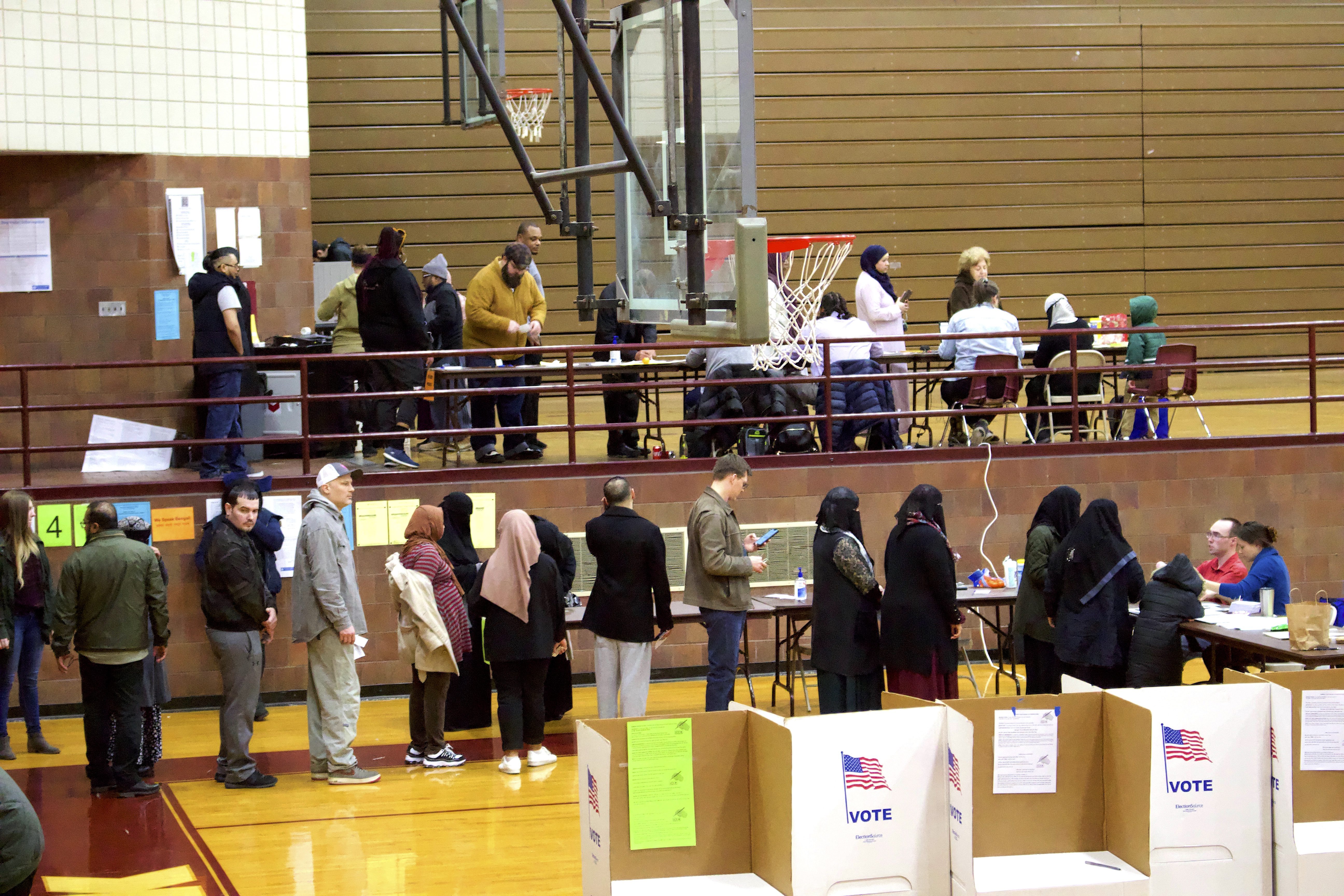 Residents are lining up in the districts in Hamtramck to vote in March 2020.  Photo: Hassan Abbas/The Arab American News